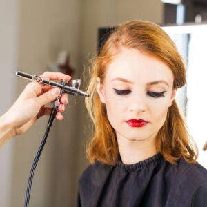 aurbrushing redhead client's cheek
